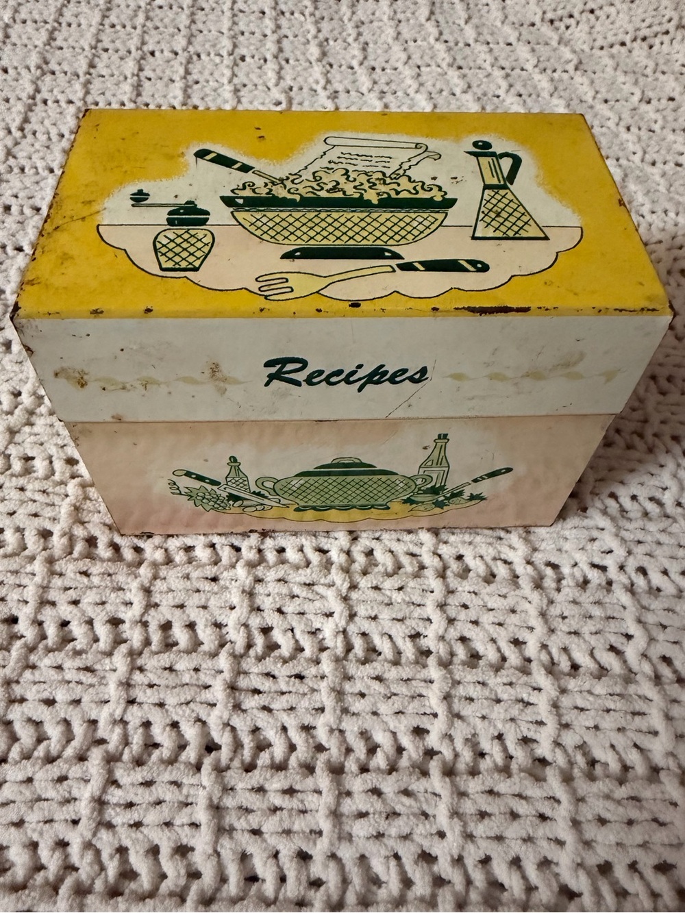 Vintage 1950s tin recipe box with kitchen graphics and "Recipes" label.